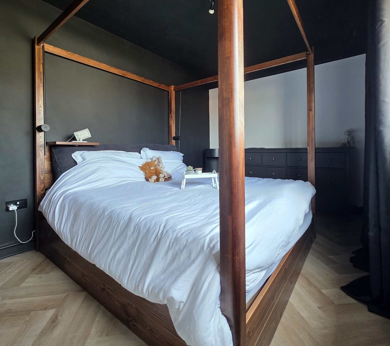 Dark flooring and black and gold bedroom styles